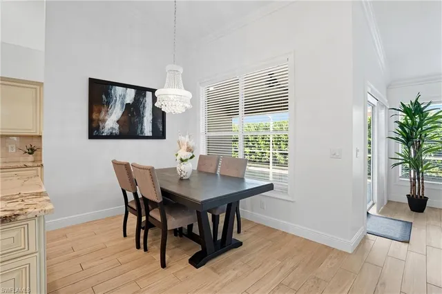 a view of a dining room with furniture and window