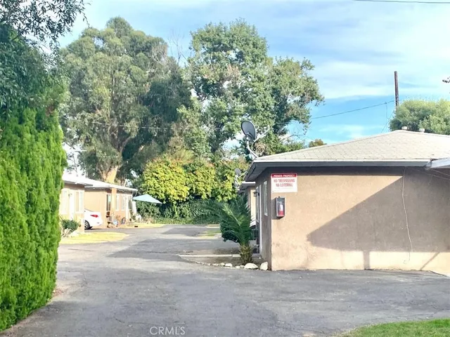a view of road with large tree