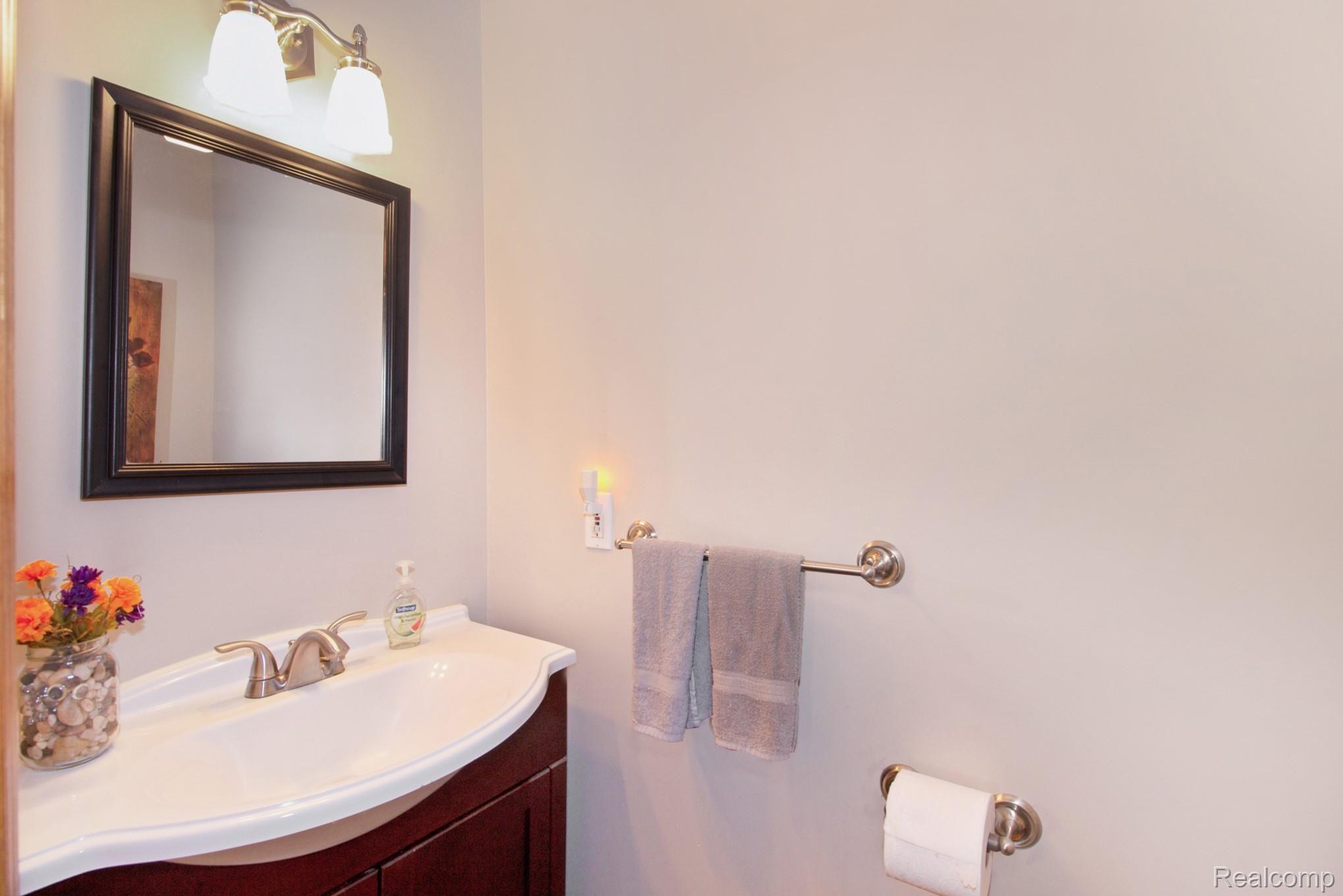1113 South Hacker Road Brighton, MI 48114 - Photo 15 of 35 Half Bathroom Off the Kitchen