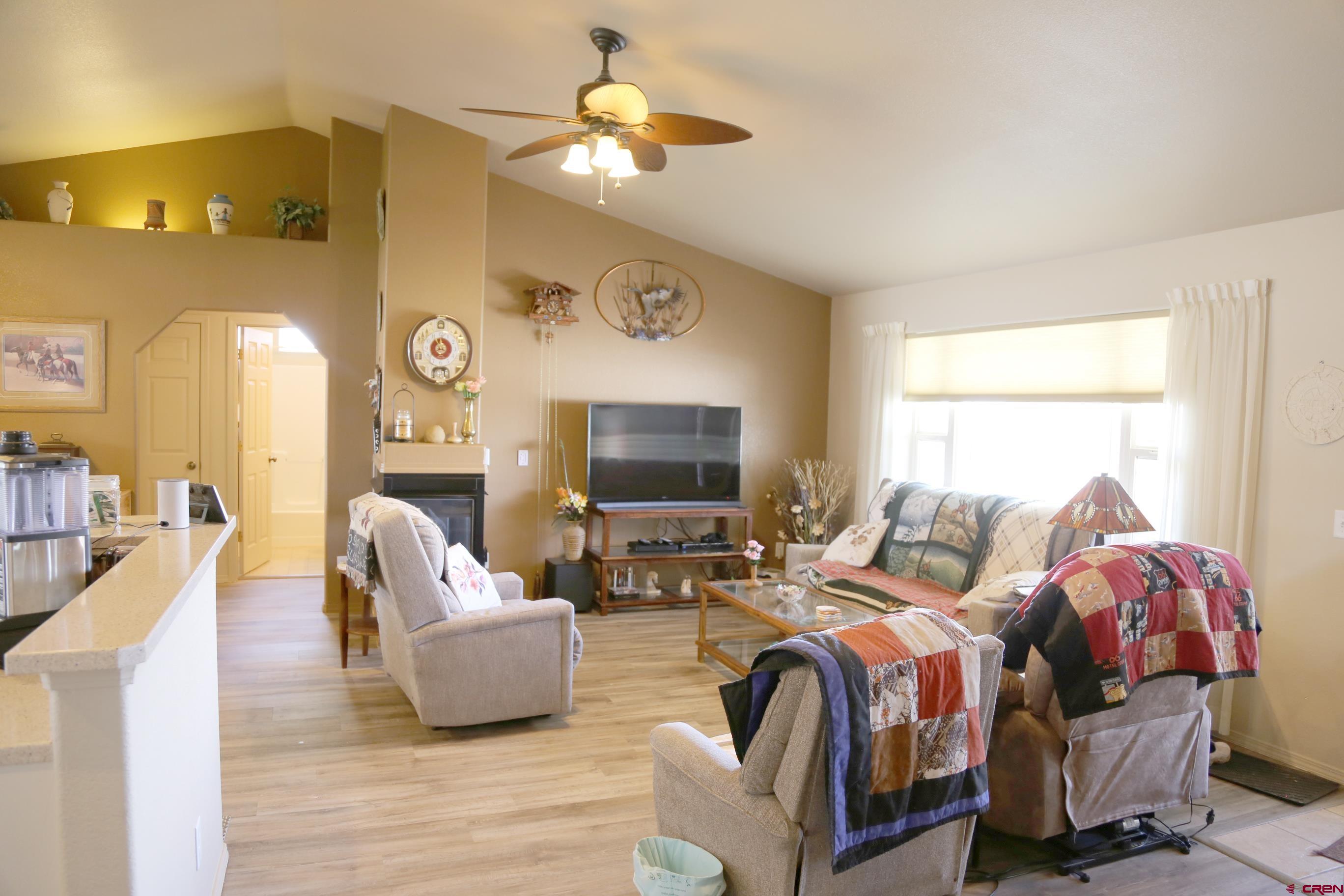 20287 Fox Ridge Drive Austin, CO 81410 - Photo 12 of 16 a living room with furniture and a flat screen tv
