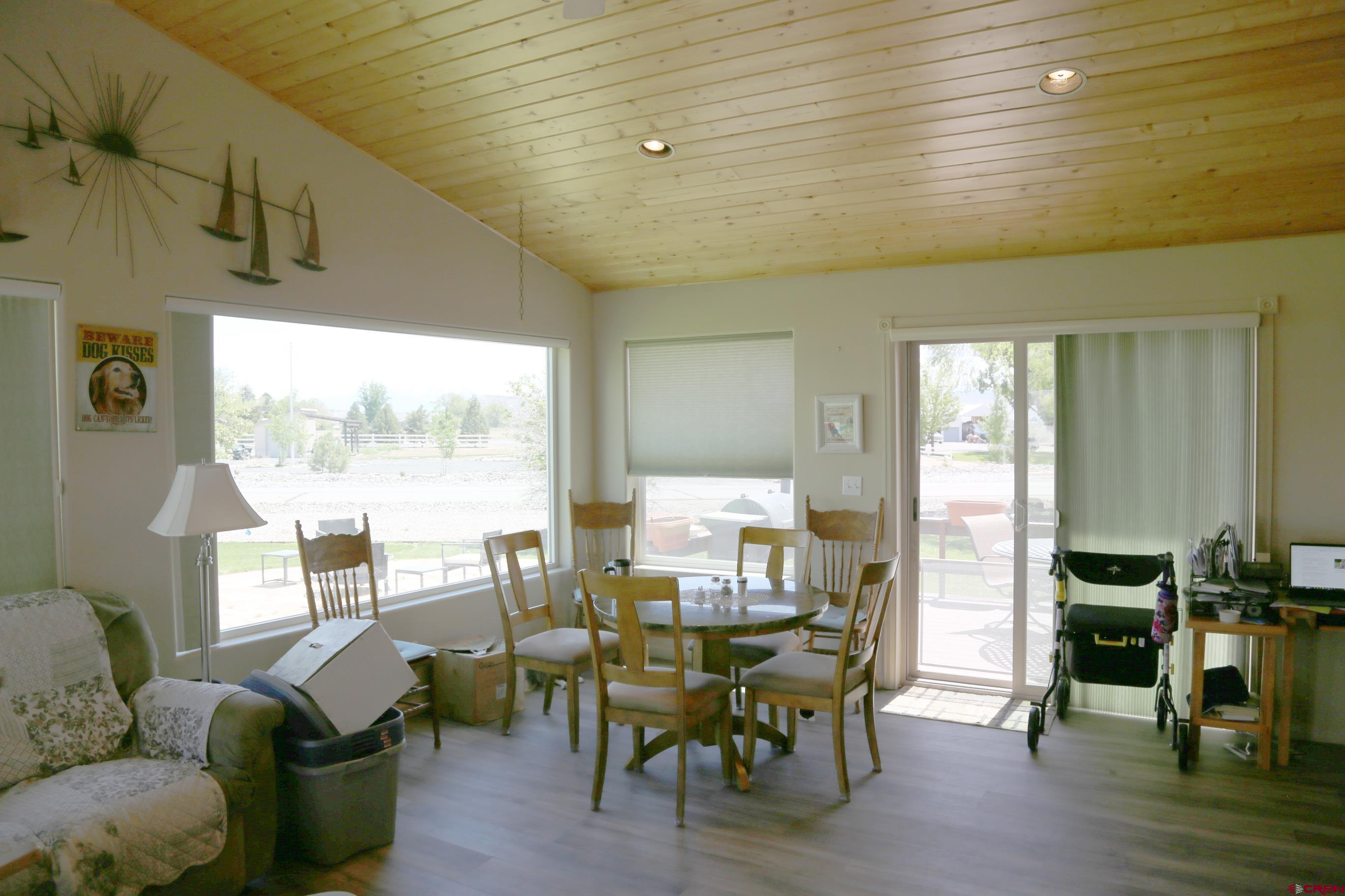 20287 Fox Ridge Drive Austin, CO 81410 - Photo 16 of 16 a view of a dining room with furniture window and outside view