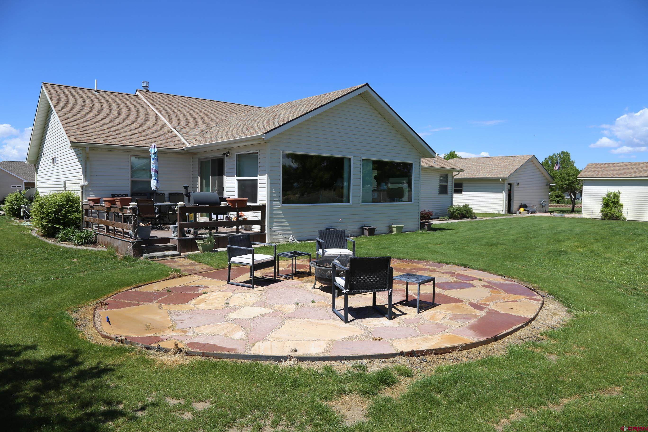 20287 Fox Ridge Drive Austin, CO 81410 - Photo 4 of 16 a view of a house with backyard sitting area and garden