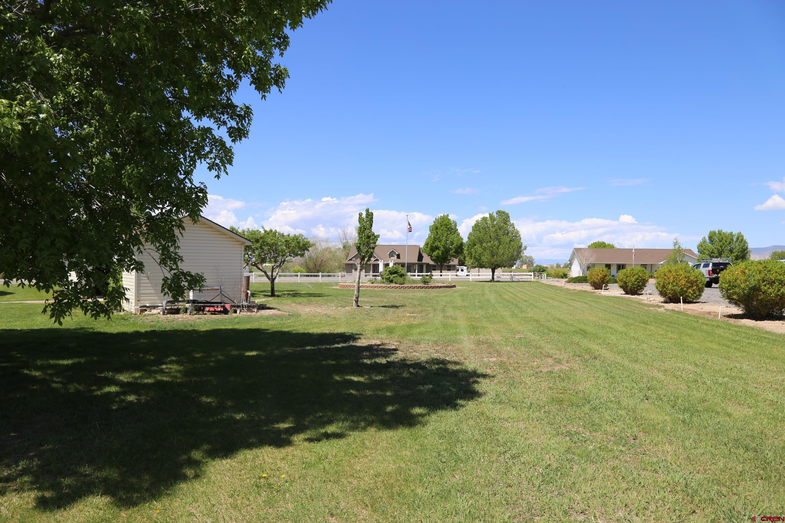 20287 Fox Ridge Drive Austin, CO 81410 - Photo 7 of 16 a view of a golf course with a lake