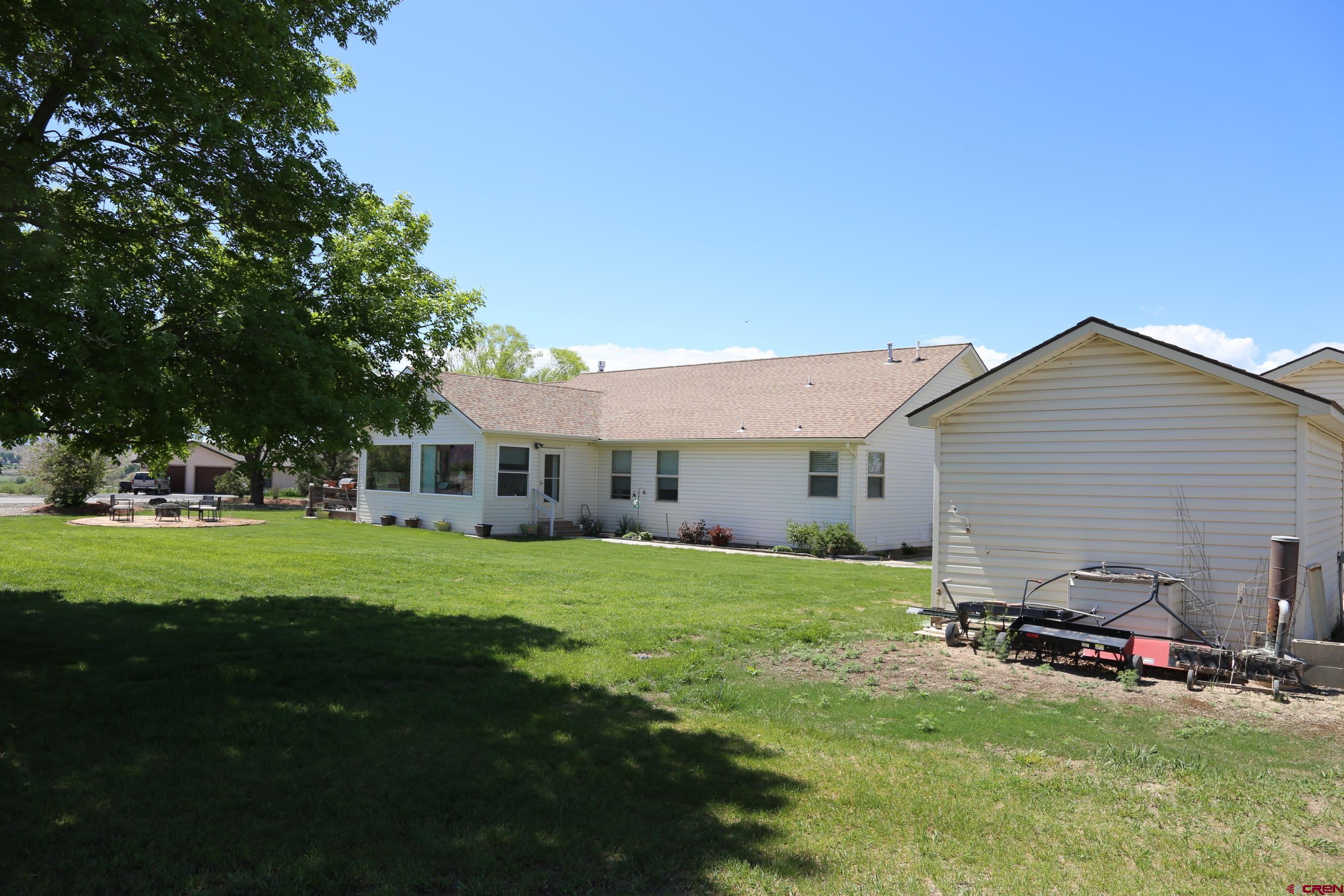 20287 Fox Ridge Drive Austin, CO 81410 - Photo 8 of 16 a view of a house with a big yard