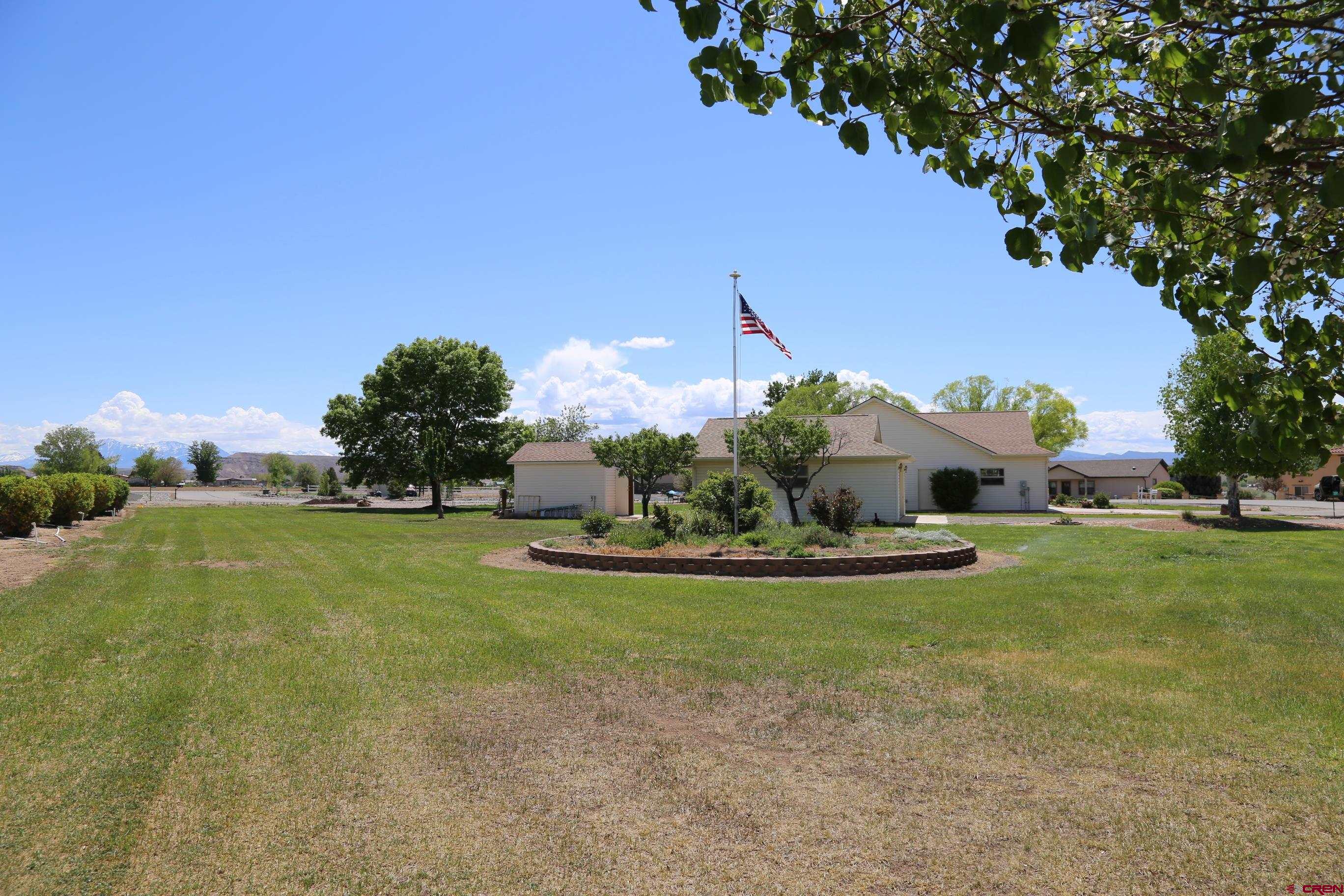 20287 Fox Ridge Drive Austin, CO 81410 - Photo 9 of 16 a view of a table and chairs in the garden