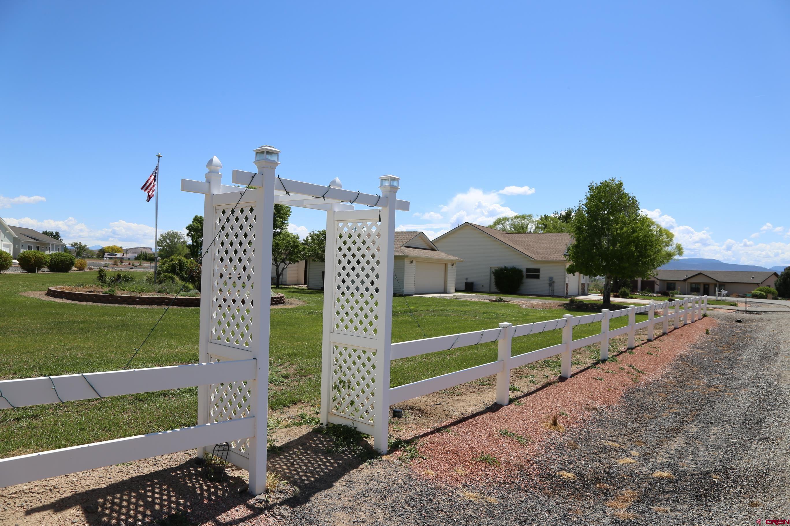20287 Fox Ridge Drive Austin, CO 81410 - Photo 10 of 16 a view of a building with a yard