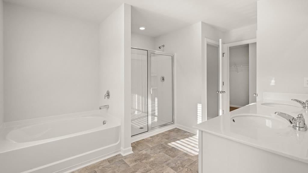 21 Rustin Ridge Dahlonega, GA 30533 - Photo 15 of 27 a bathroom with a tub sink and mirror