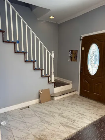 a view of a hallway with staircase