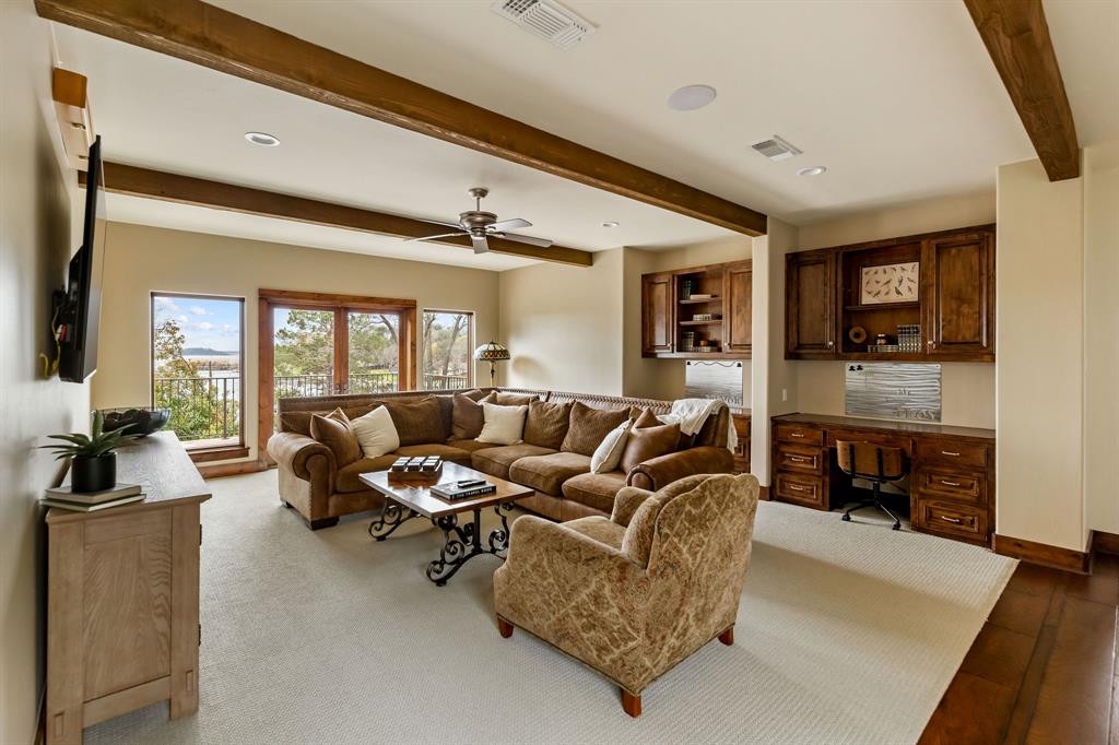 9930 Boat Club Road Fort Worth, TX 76179 - Photo 18 of 40 Located upstairs in the main house, this game room provides ample opportunity of design and function. The two double doors lead you to a balcony providing breathtaking views of Eagle Mountain Lake!