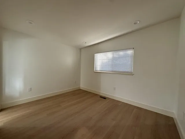 a bathroom with a sink mirror and vanity
