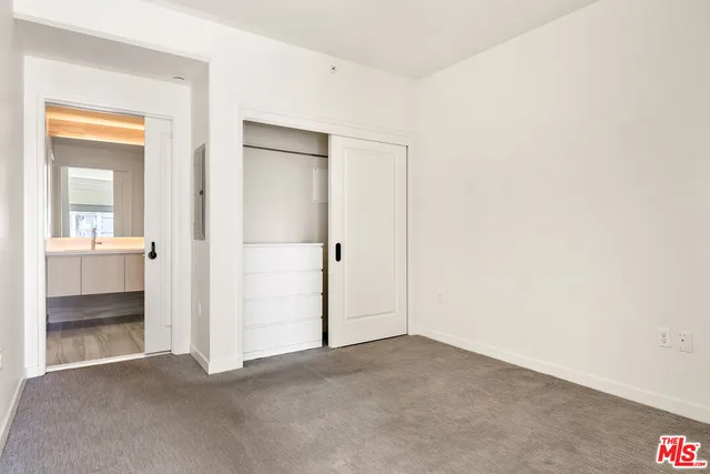 an empty room with a bathroom