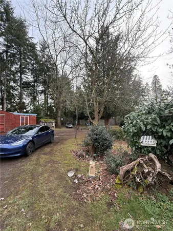 a view of street with parked cars