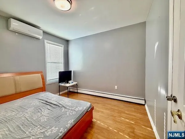 a bedroom with a bed and a desk