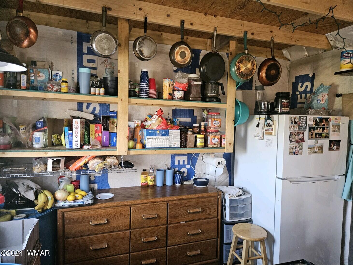 110 County Road Concho, AZ 85924 - Photo 13 of 21 a kitchen with a refrigerator and cabinets