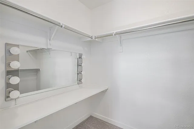 a view of an empty walk in closet