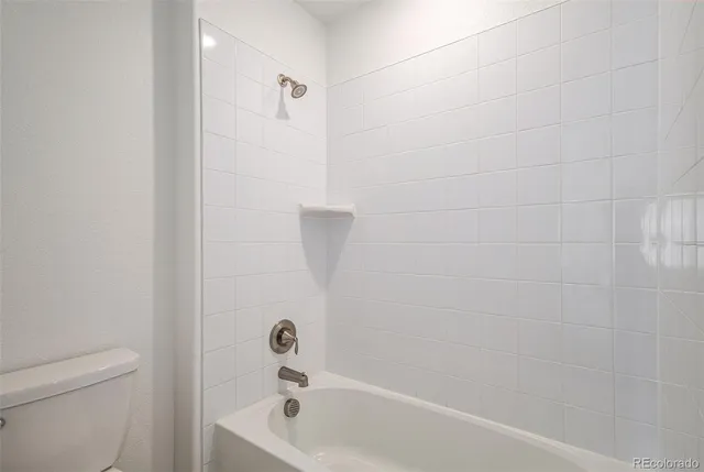 a bathroom with a tub and a shower