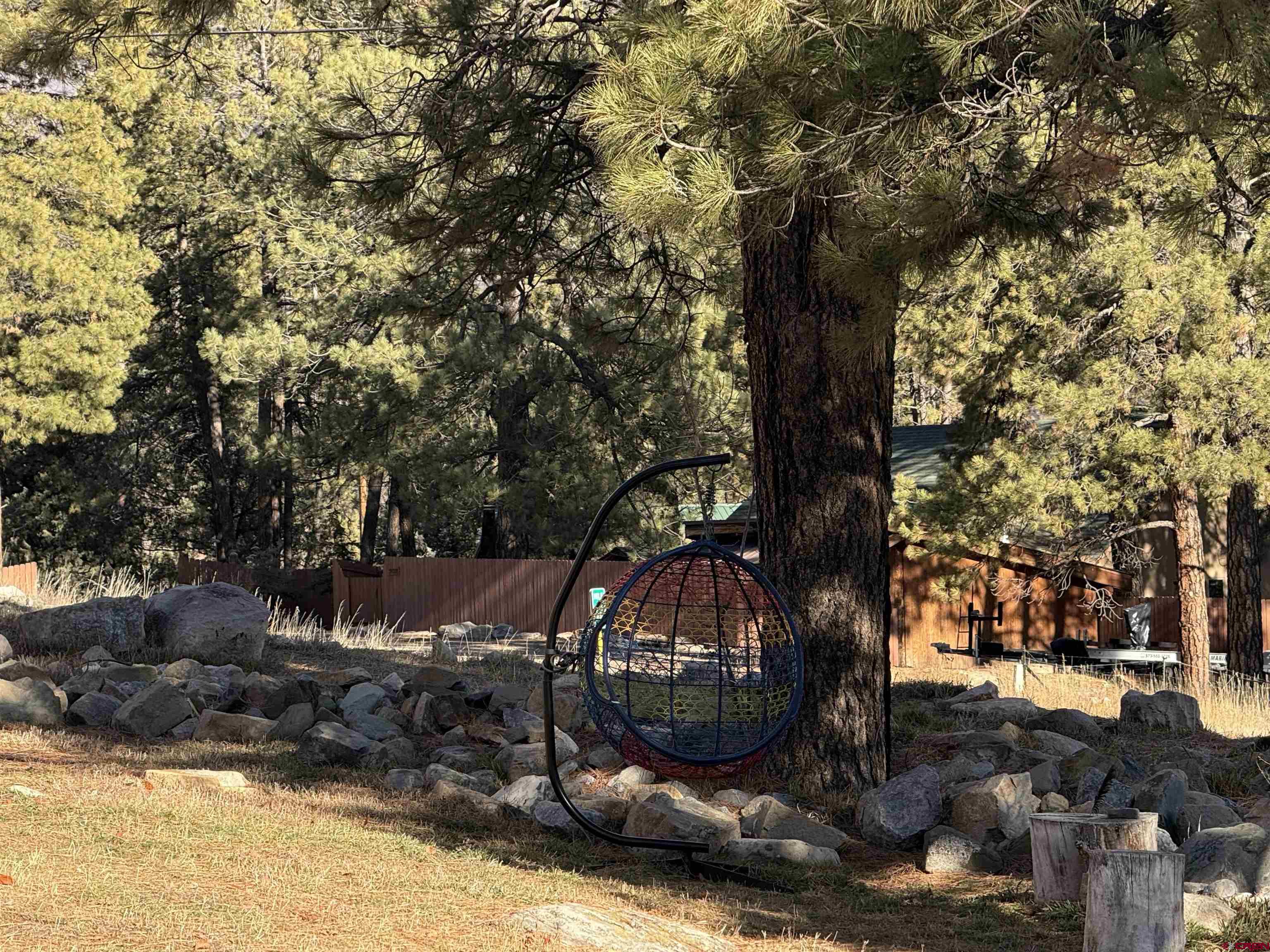 34237 Highway 550, Unit 27 Durango, CO 81301 - Photo 27 of 45 a view of a backyard with large trees