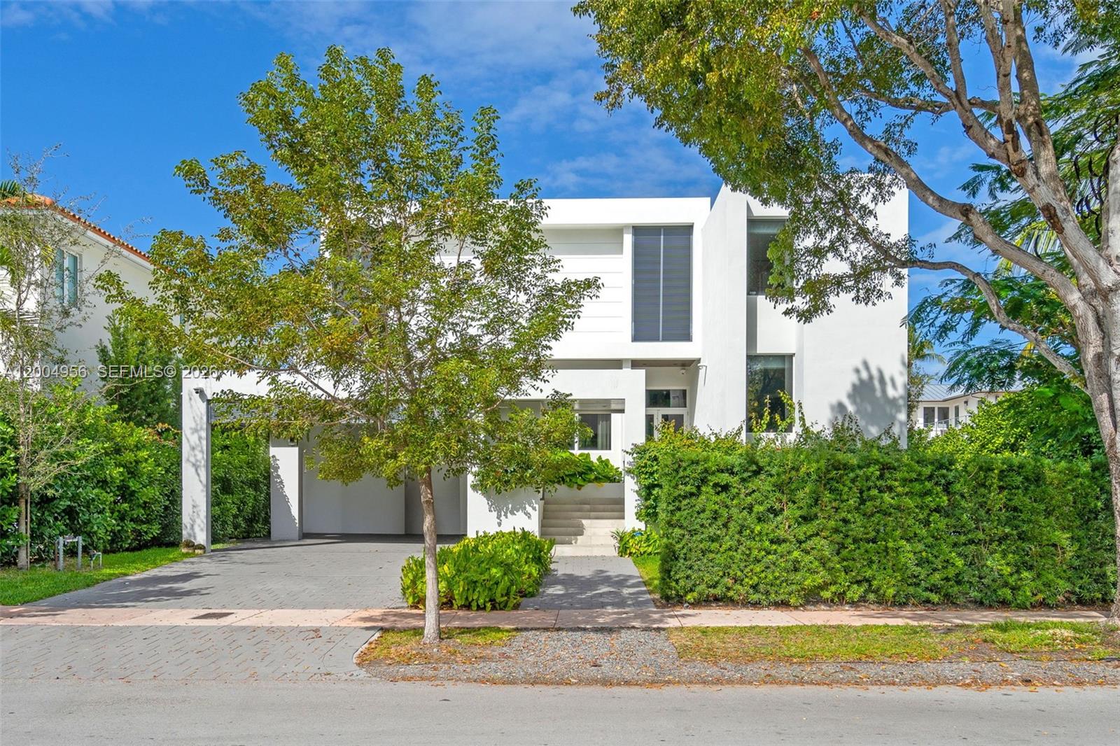 285 West Mashta Drive Key Biscayne, FL 33149 - Photo 1 of 42 a view of a street with a house