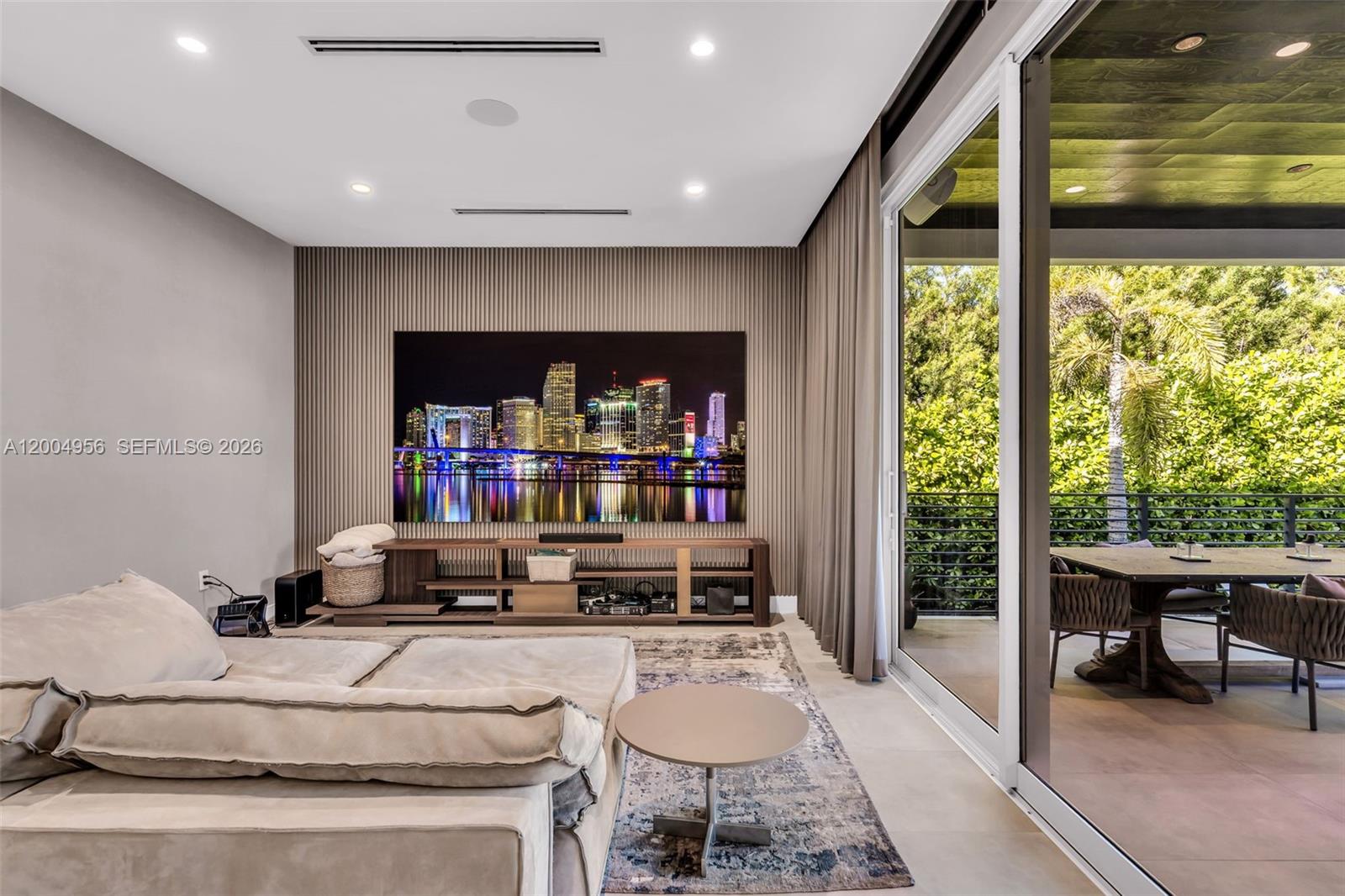 285 West Mashta Drive Key Biscayne, FL 33149 - Photo 13 of 42 a living room with a large window and furniture