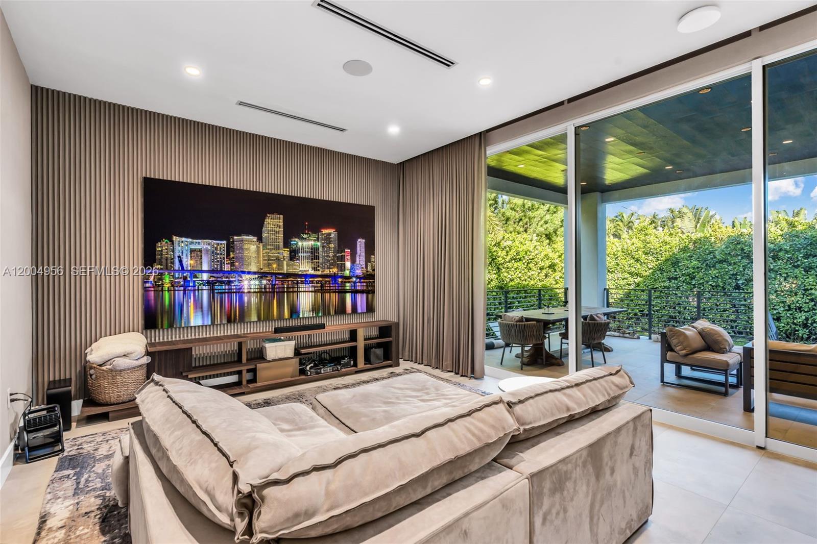 285 West Mashta Drive Key Biscayne, FL 33149 - Photo 14 of 42 a living room with a large window