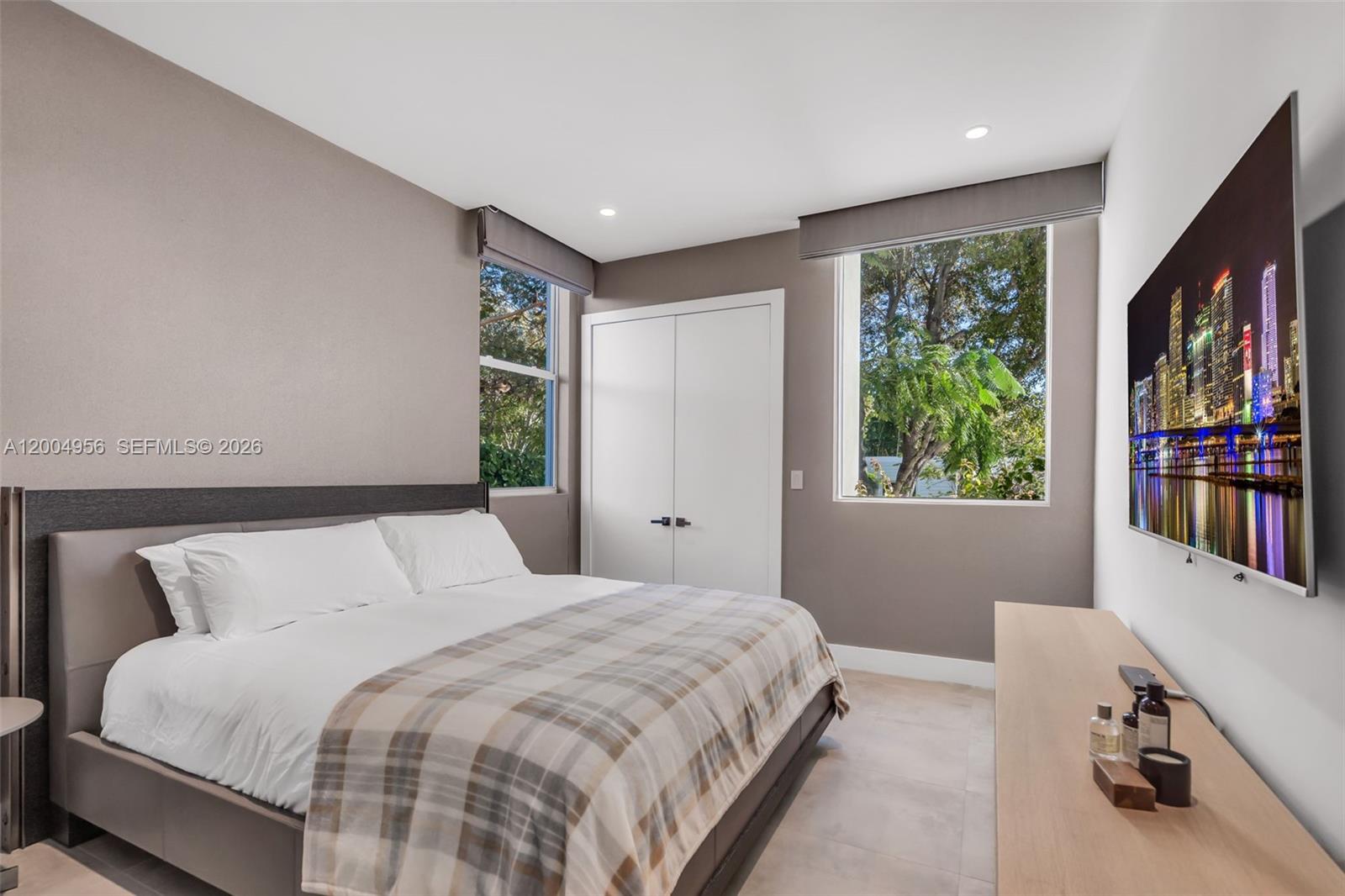 285 West Mashta Drive Key Biscayne, FL 33149 - Photo 16 of 42 a bedroom with a large bed and a window