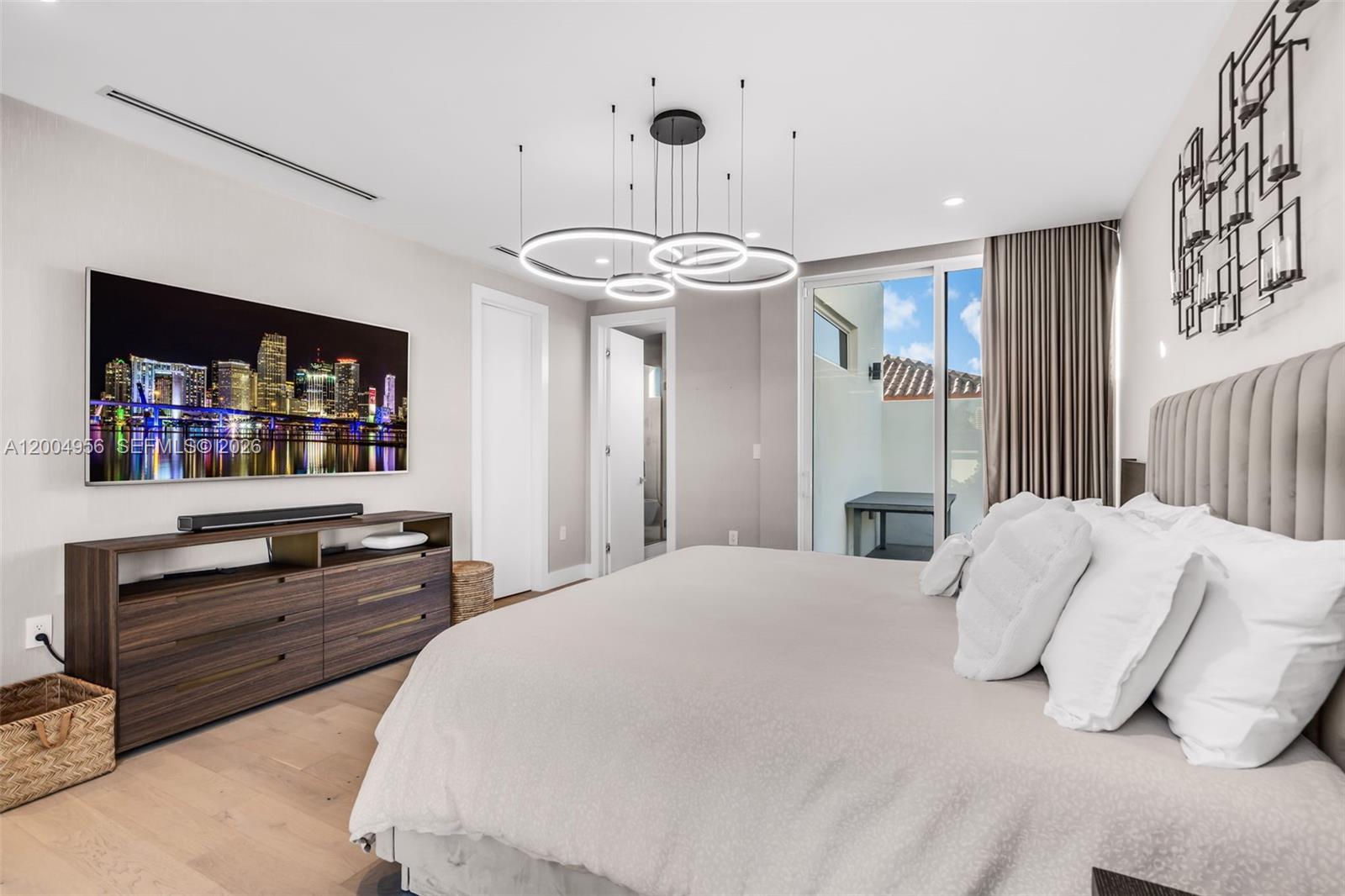 285 West Mashta Drive Key Biscayne, FL 33149 - Photo 20 of 42 a bedroom with a bed and a flat screen tv