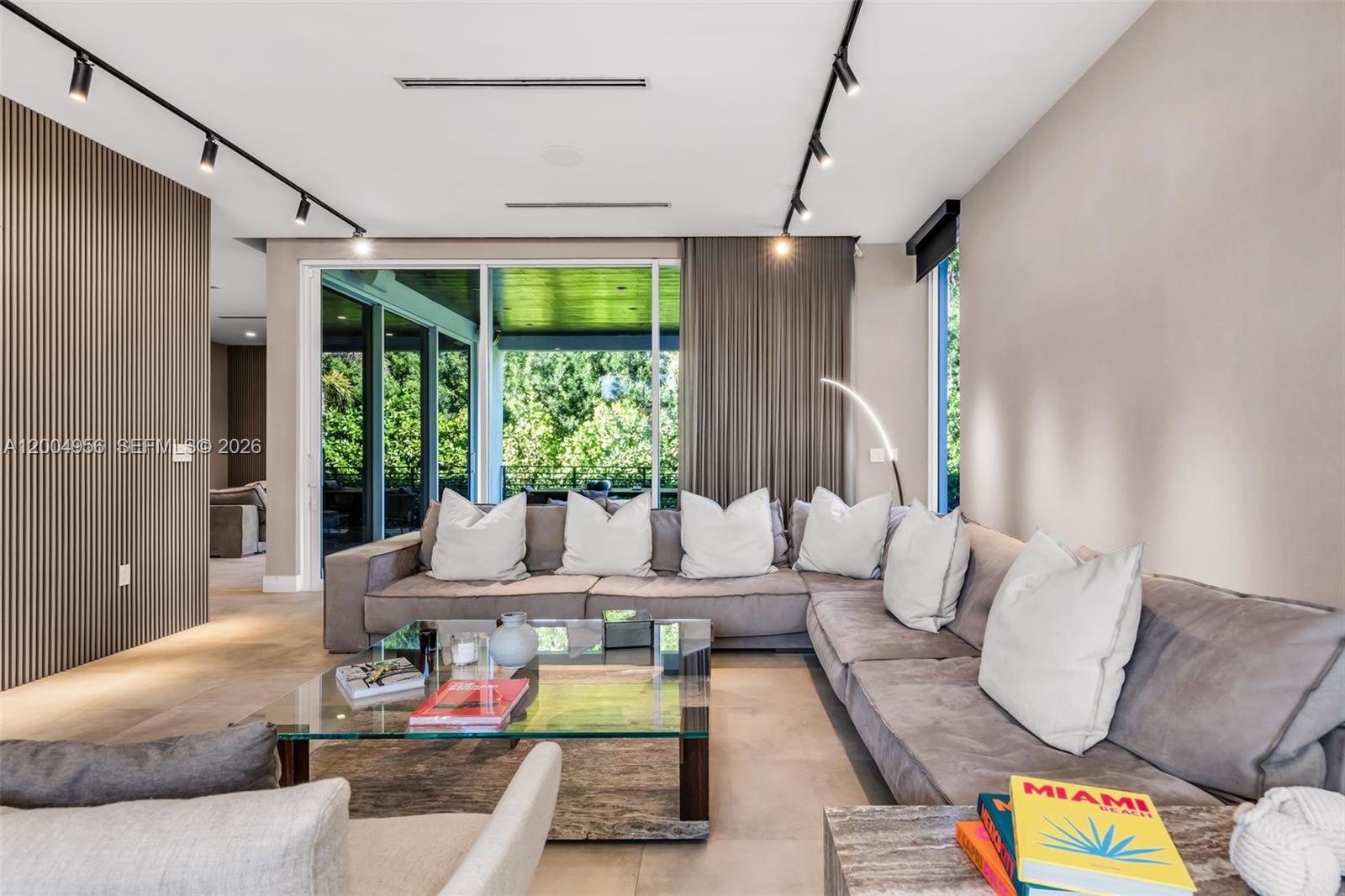 285 West Mashta Drive Key Biscayne, FL 33149 - Photo 2 of 42 a living room with furniture and a large window