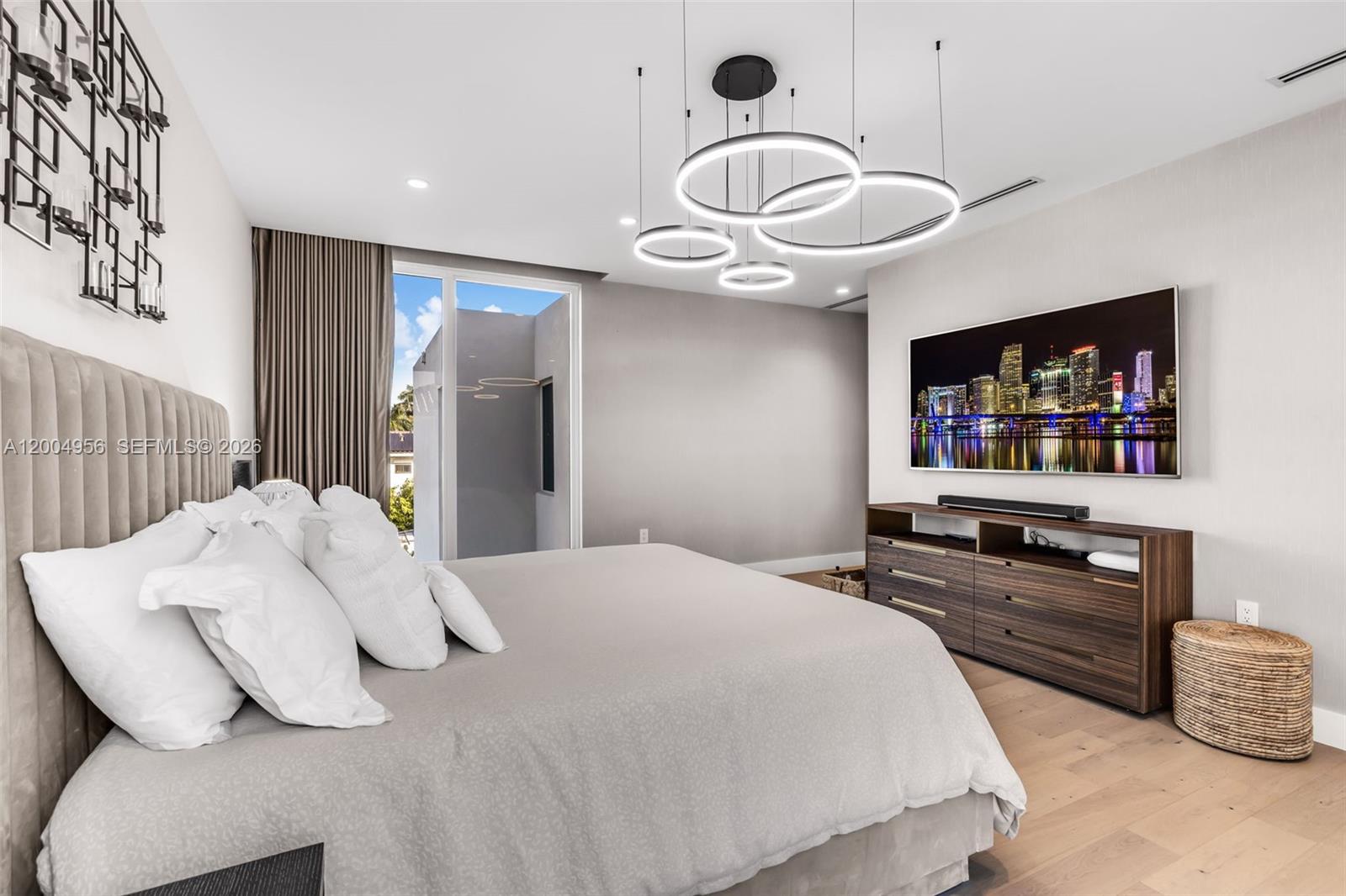 285 West Mashta Drive Key Biscayne, FL 33149 - Photo 22 of 42 a bedroom with a bed and a flat screen tv