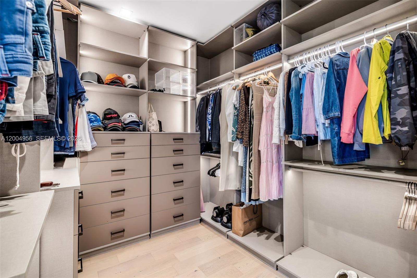 285 West Mashta Drive Key Biscayne, FL 33149 - Photo 26 of 42 a view of walk in closet with clothes and shoes