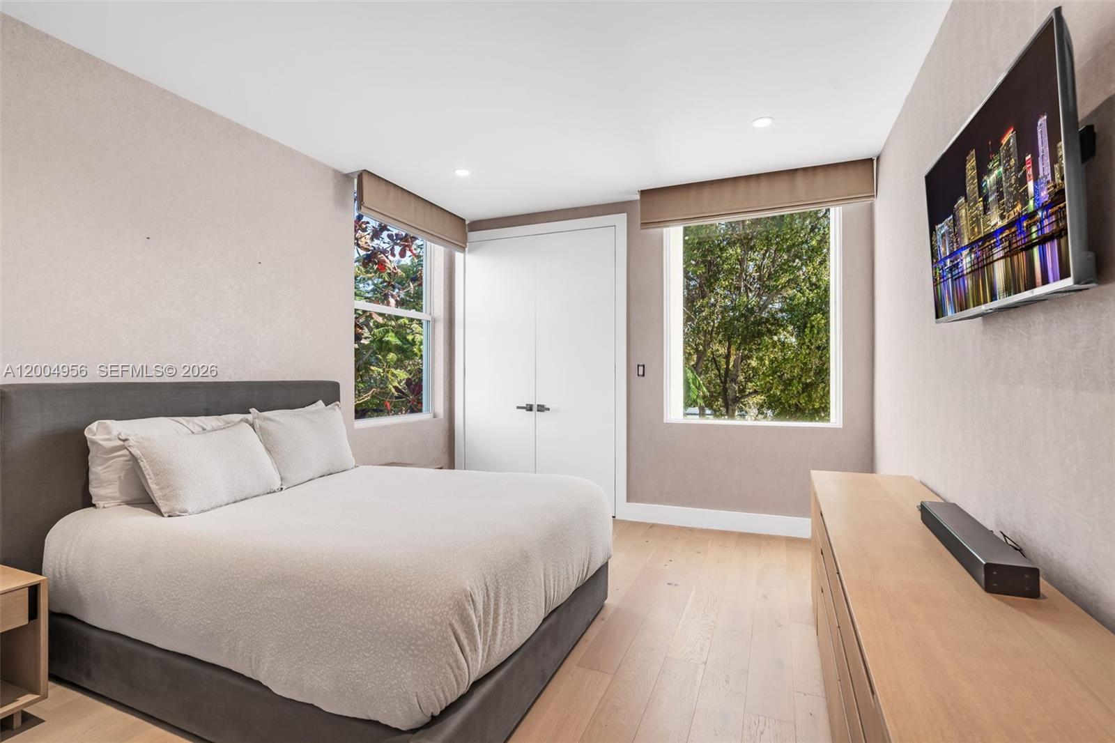285 West Mashta Drive Key Biscayne, FL 33149 - Photo 30 of 42 a bedroom with a large bed and a window