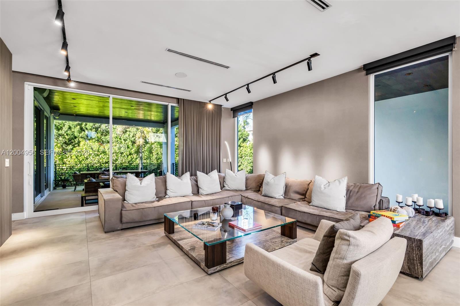 285 West Mashta Drive Key Biscayne, FL 33149 - Photo 3 of 42 a living room with furniture and a large window