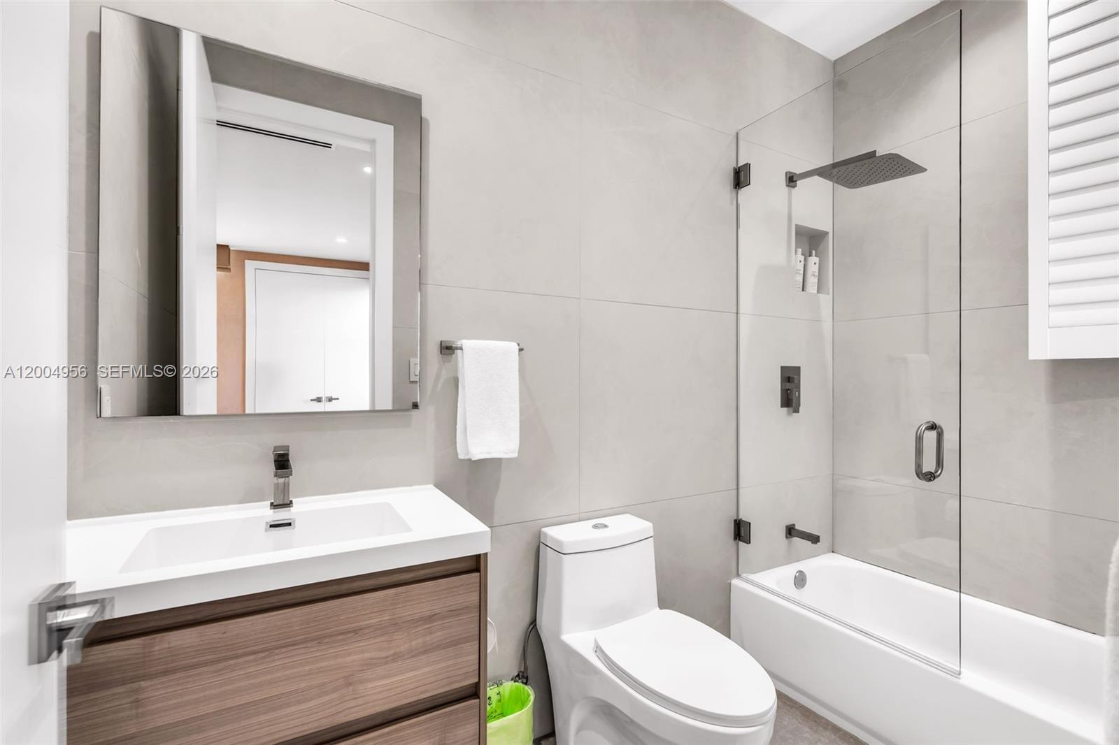 285 West Mashta Drive Key Biscayne, FL 33149 - Photo 32 of 42 a bathroom with a sink a toilet and shower
