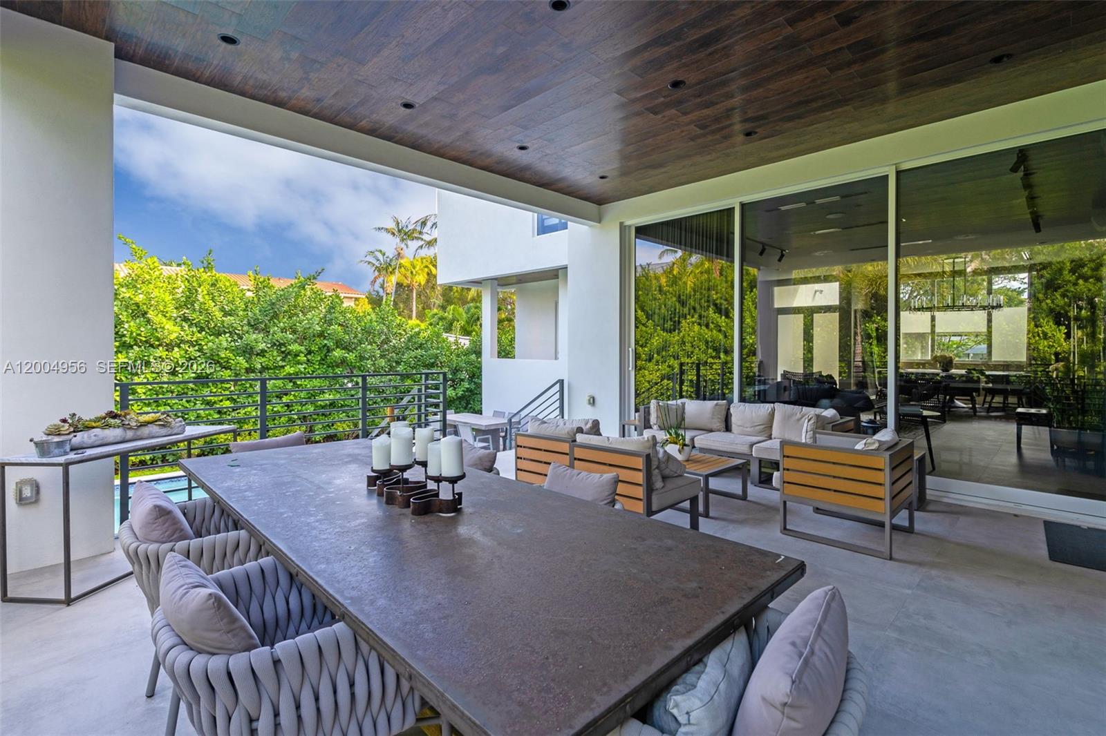 285 West Mashta Drive Key Biscayne, FL 33149 - Photo 33 of 42 a living room with patio furniture and a potted plant
