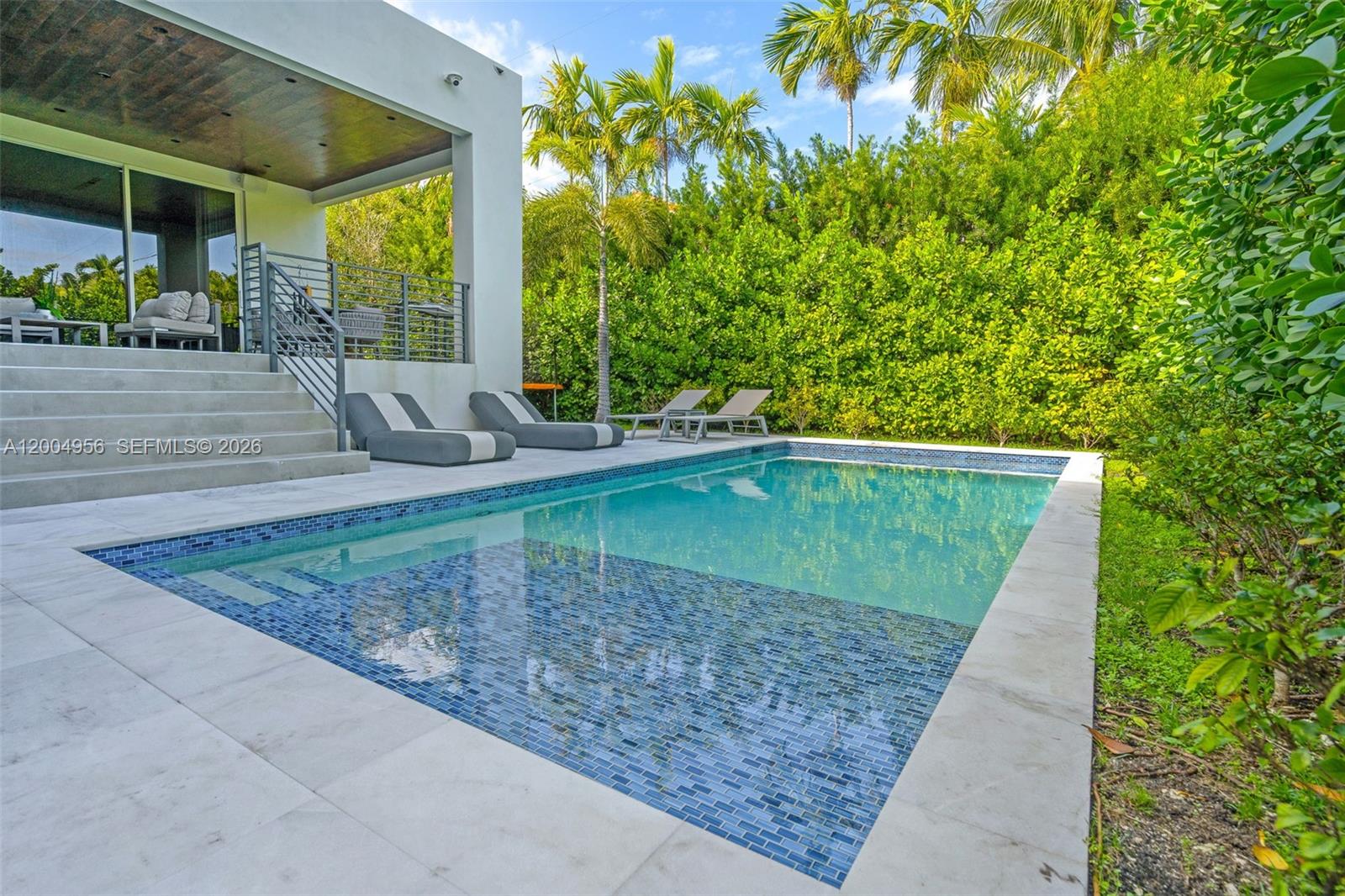 285 West Mashta Drive Key Biscayne, FL 33149 - Photo 36 of 42 a backyard of a house with lots of green space