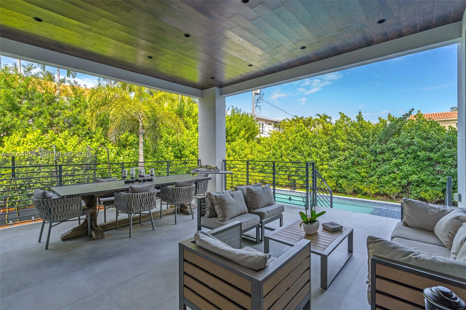 285 West Mashta Drive Key Biscayne, FL 33149 - Photo 38 of 42 a outdoor living space with furniture and garden view