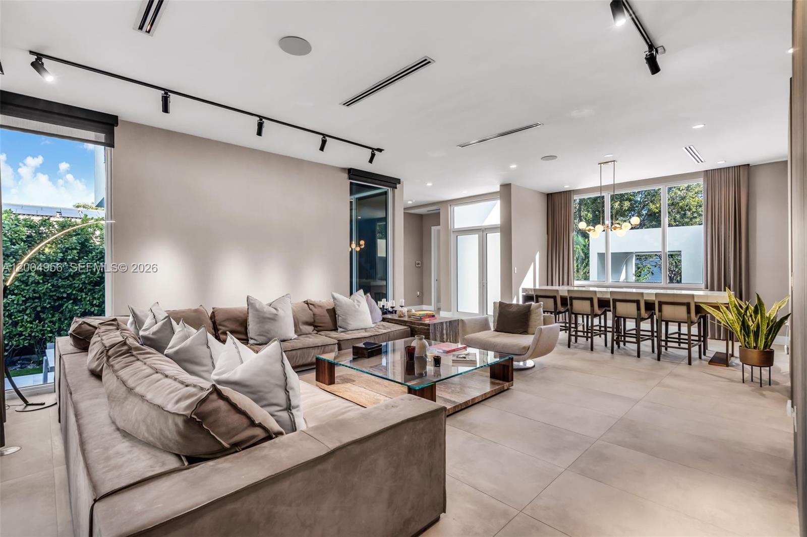 285 West Mashta Drive Key Biscayne, FL 33149 - Photo 4 of 42 a living room with furniture and floor to ceiling windows