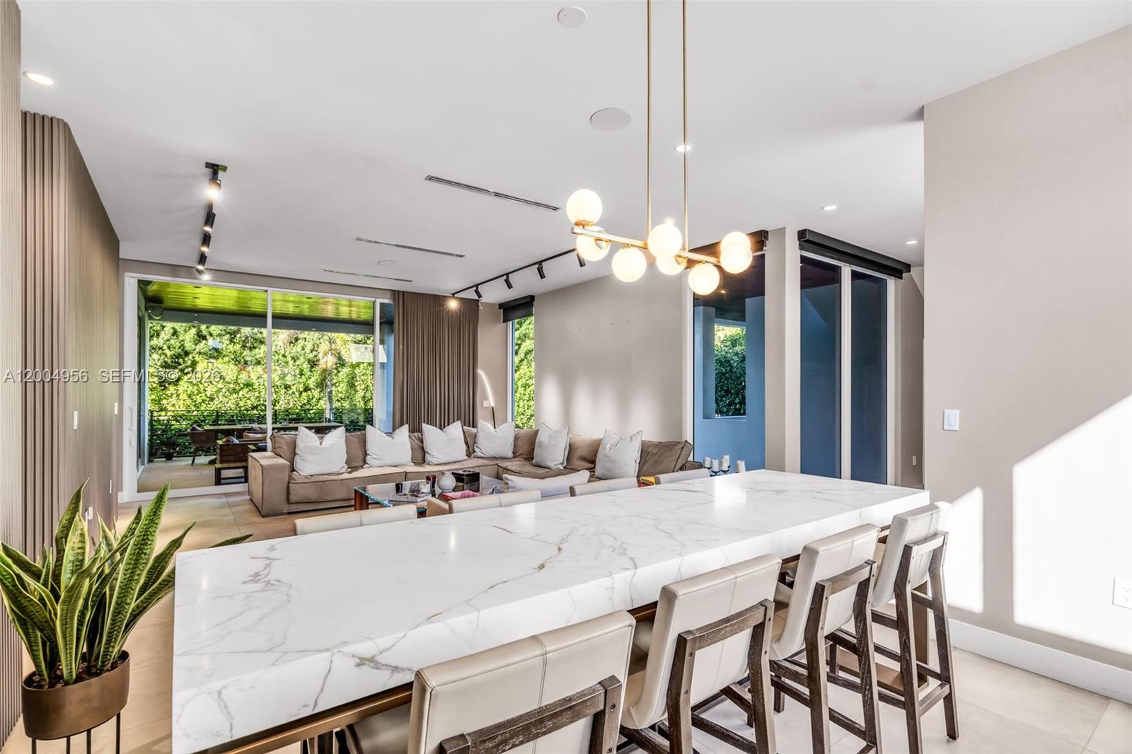 285 West Mashta Drive Key Biscayne, FL 33149 - Photo 7 of 42 a view of a dining room with furniture window and outside view