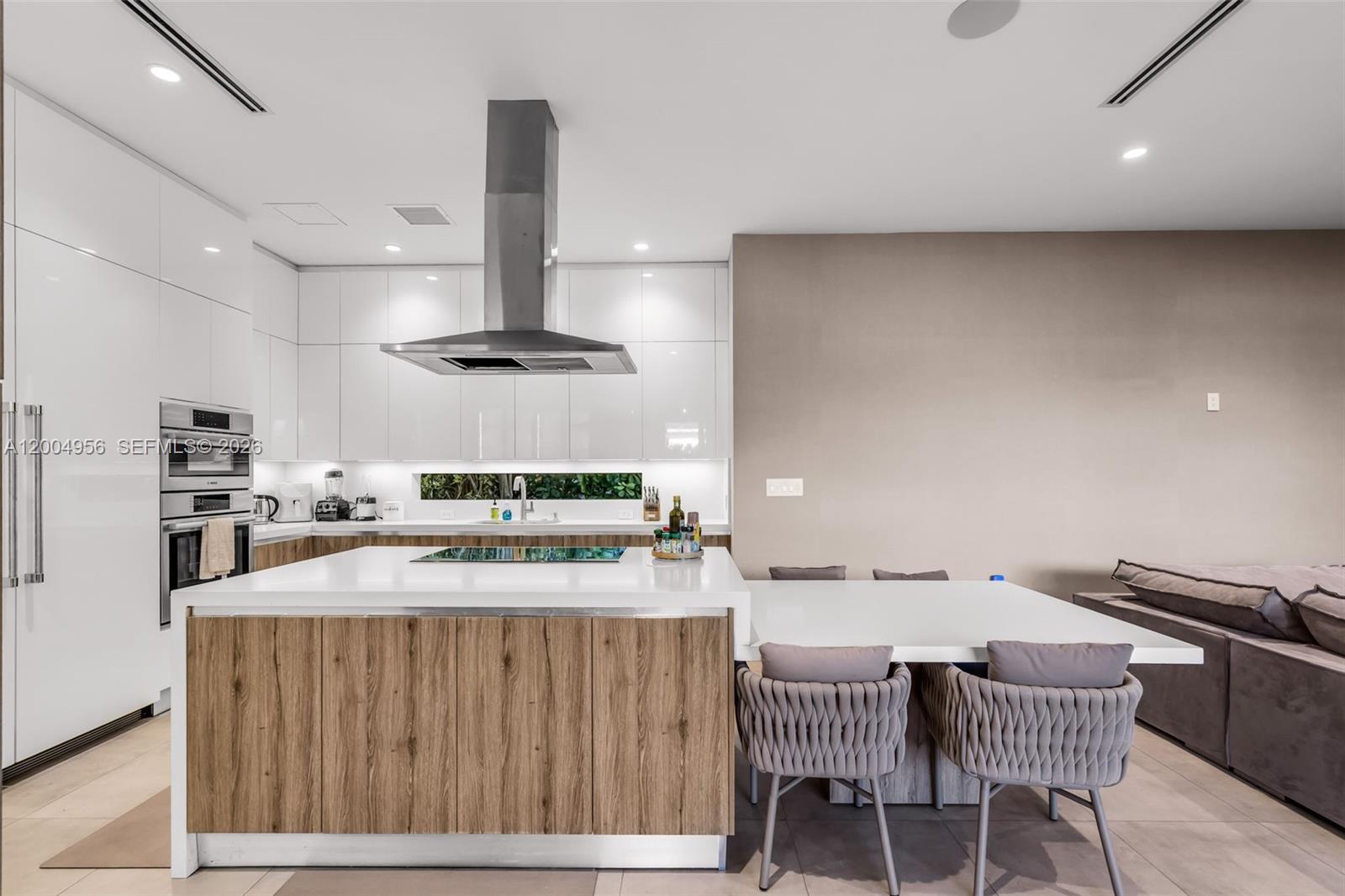 285 West Mashta Drive Key Biscayne, FL 33149 - Photo 8 of 42 a kitchen with a table and chairs