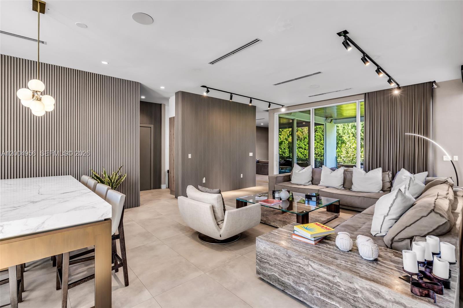 285 West Mashta Drive Key Biscayne, FL 33149 - Photo 10 of 42 a living room with furniture and a large window