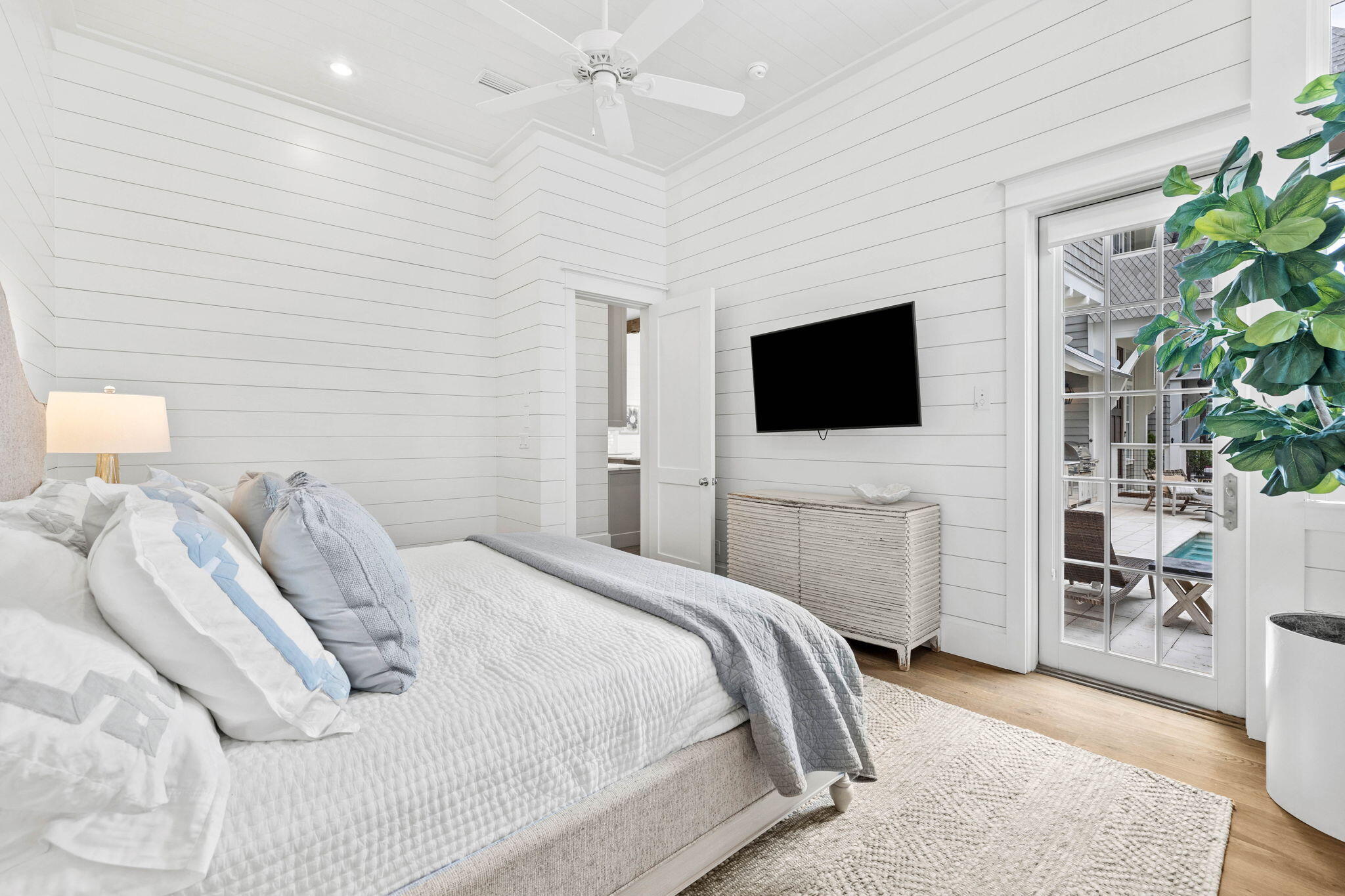 28 Honor Ln Inlet Beach Inlet Beach, FL 32461 - Photo 32 of 99 a bedroom with a bed and a flat screen tv