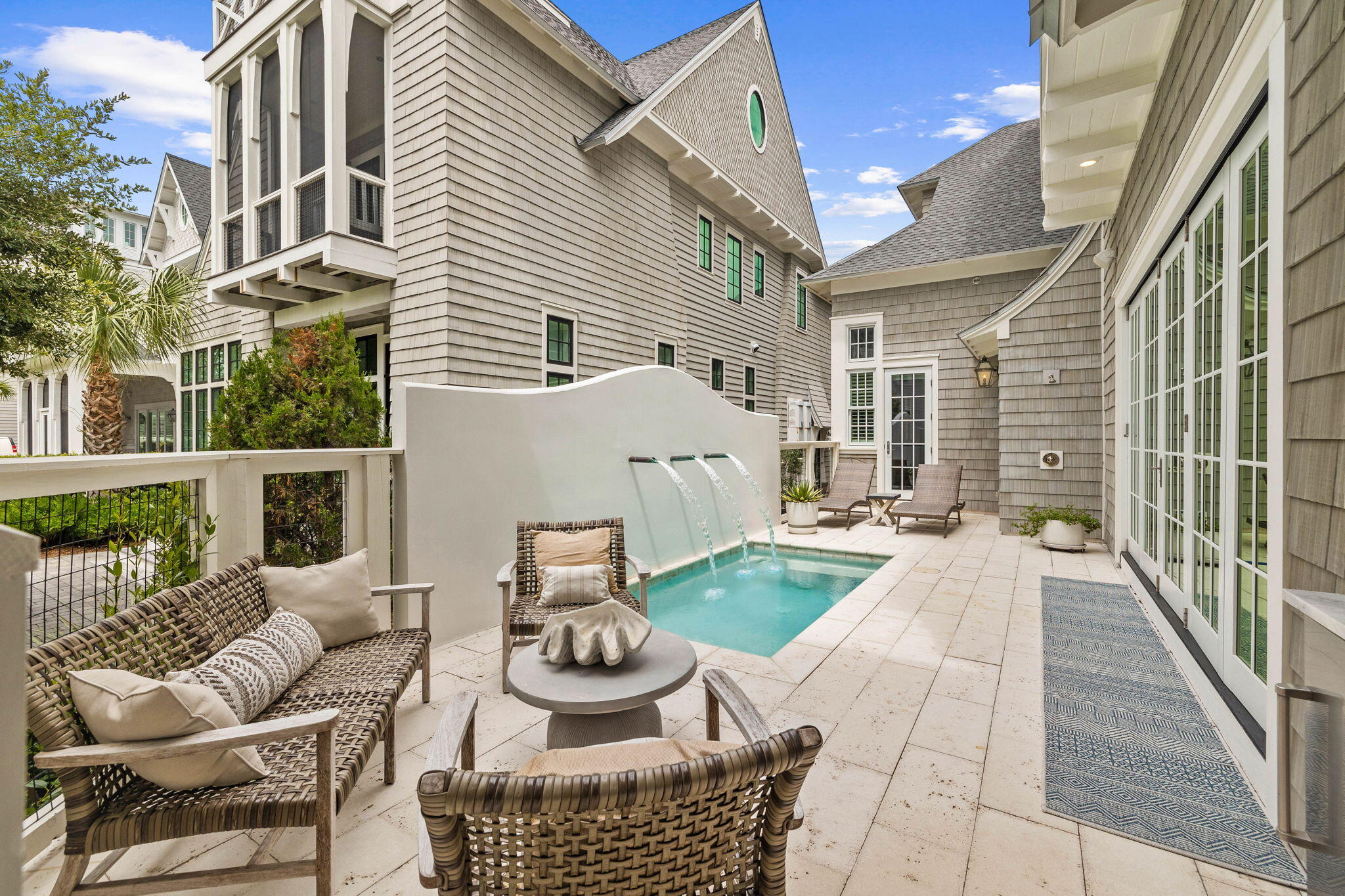 28 Honor Ln Inlet Beach Inlet Beach, FL 32461 - Photo 5 of 99 a view of a patio with couches table and chairs and potted plants