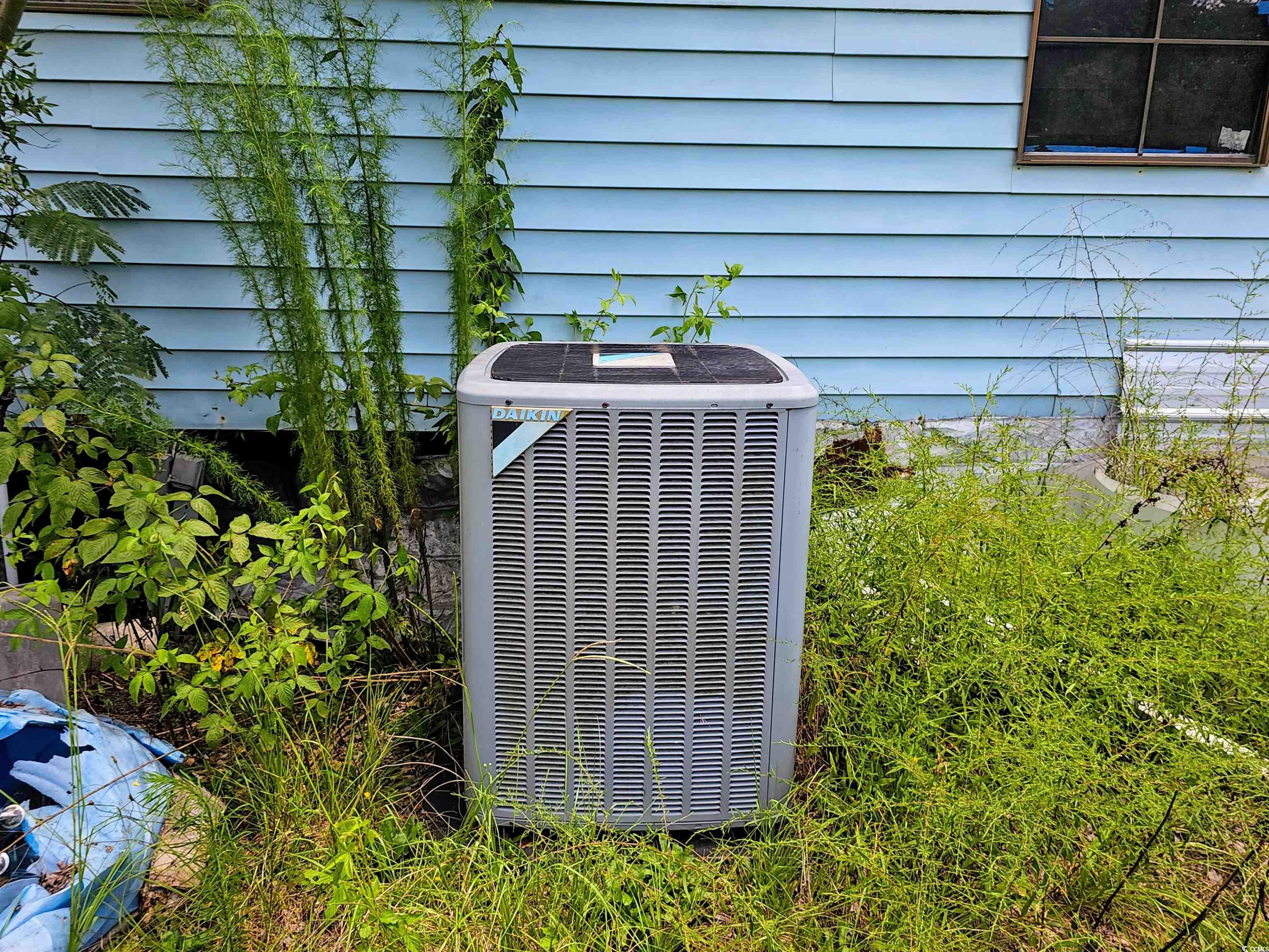 827 1/2 North Firetower Road Florence, SC 29506 - Photo 22 of 29 Exterior view of a central air condition unit