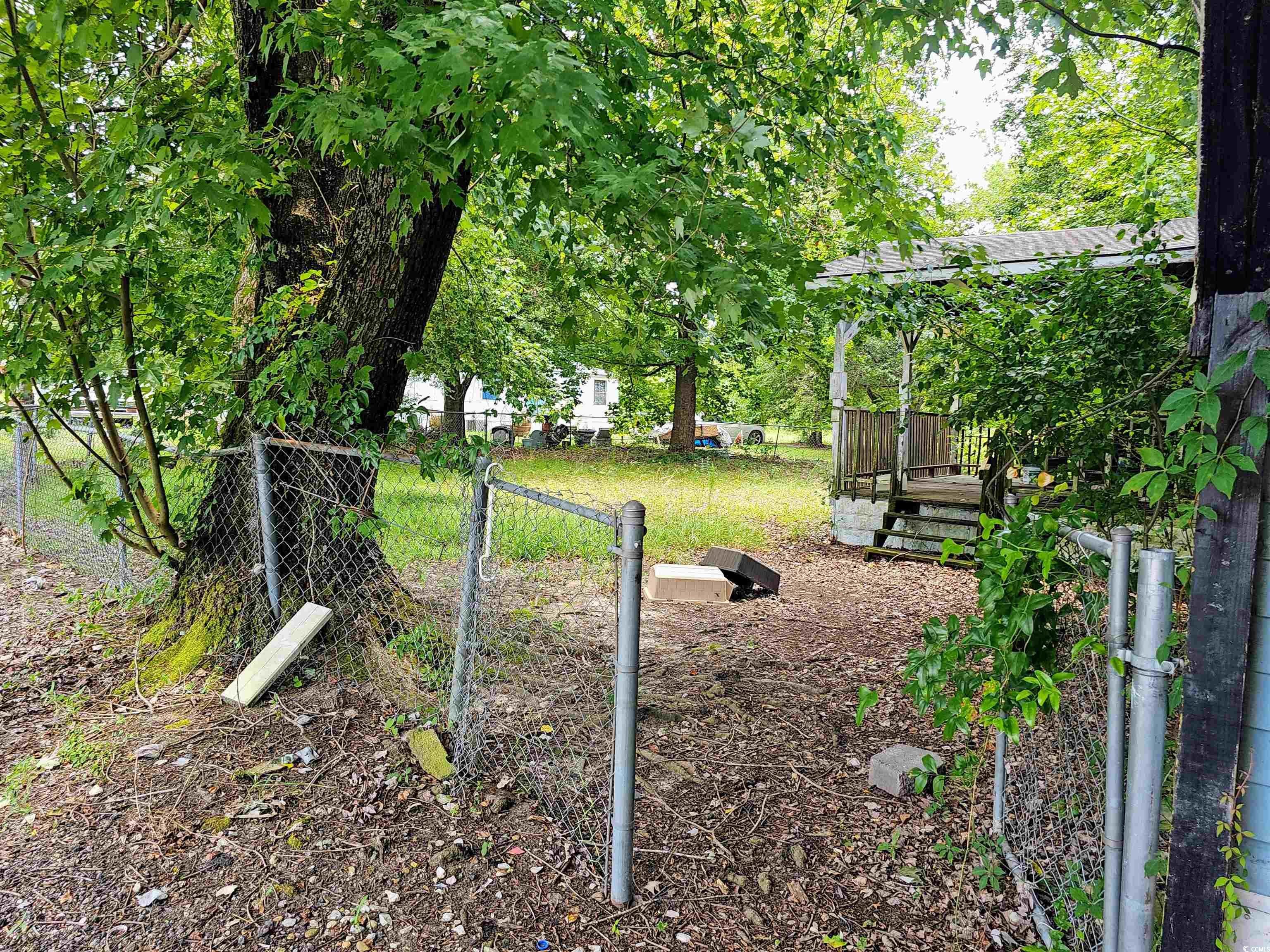 827 1/2 North Firetower Road Florence, SC 29506 - Photo 27 of 29 View of yard with a wooden deck