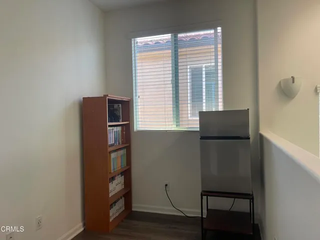a view of a kitchen with a sink and a stove top oven