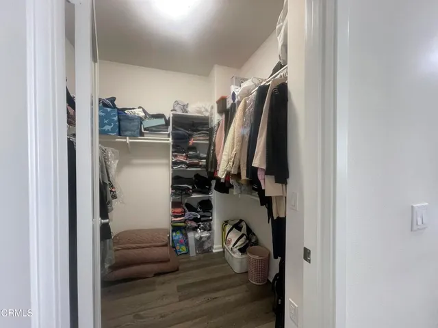 a kitchen with stainless steel appliances granite countertop a refrigerator and a stove