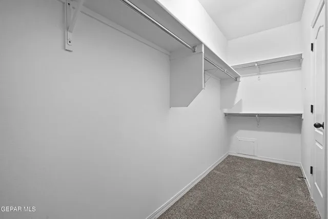 a view of an empty walk in closet