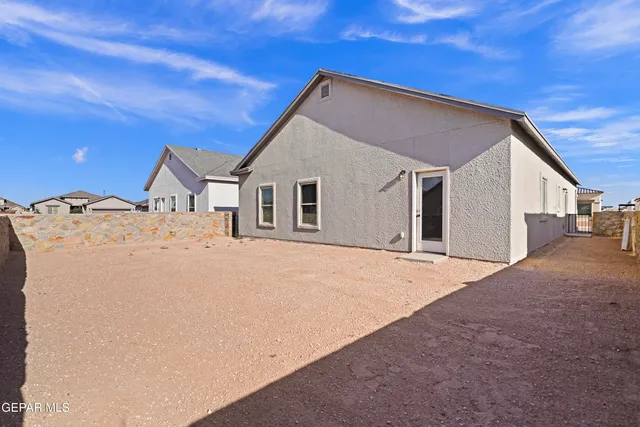a view of a house with a house and yard