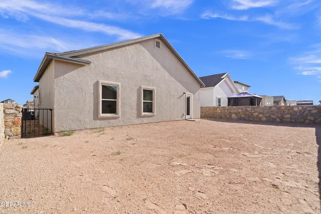 a view of a house with a snow in the yard