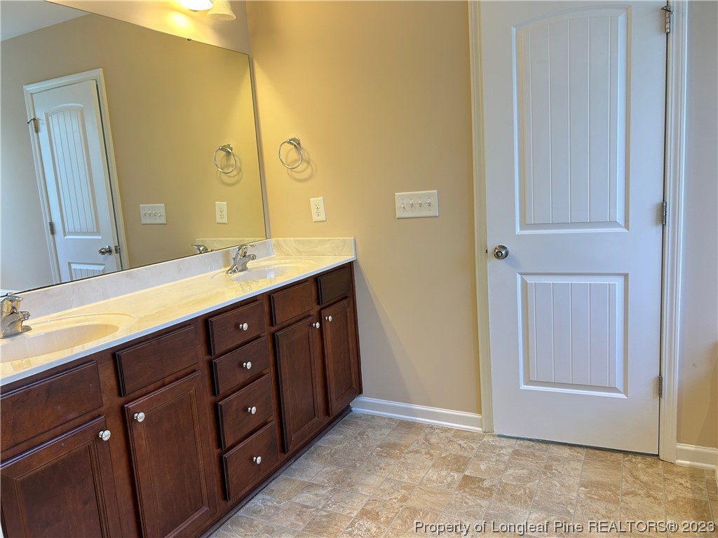 145 Taplow Trail Cameron, NC 28326 - Photo 11 of 15 a bathroom with a double vanity sink and a mirror