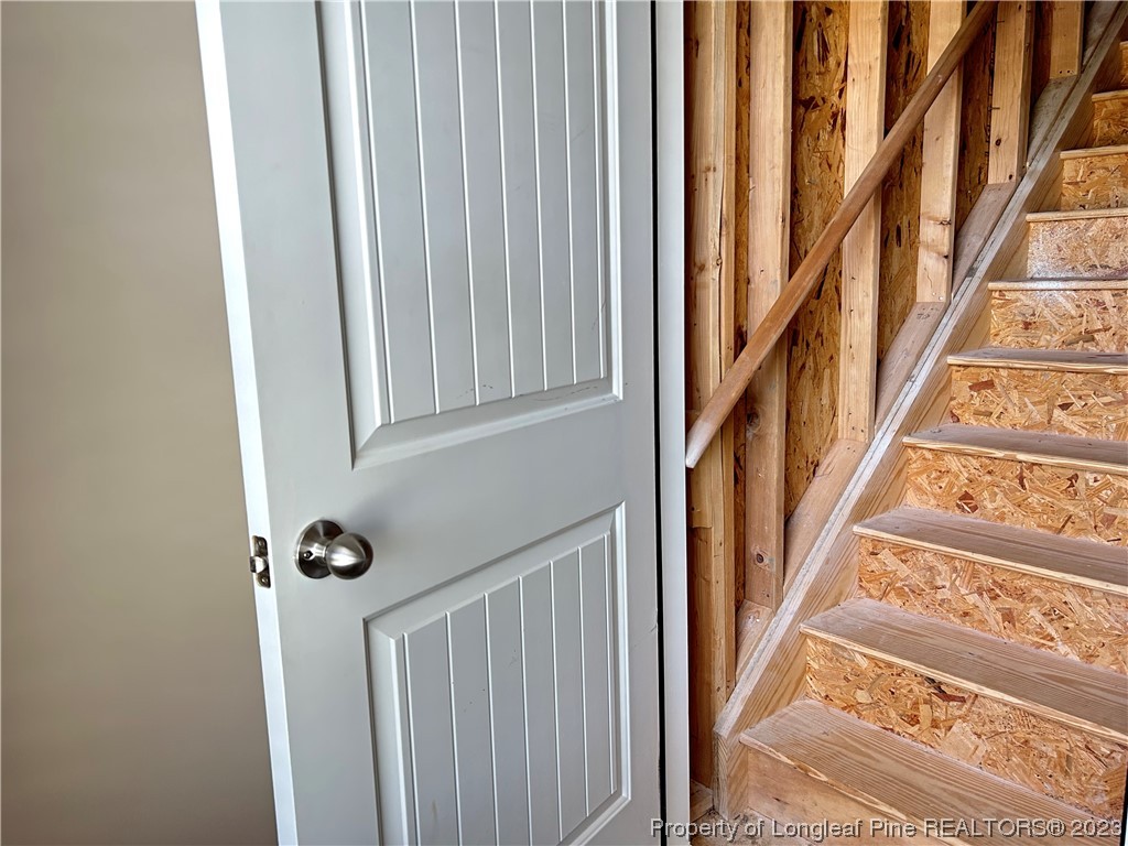 145 Taplow Trail Cameron, NC 28326 - Photo 13 of 15 a view of staircase with lots of frames on wall and a large window